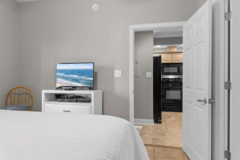 Bedroom 2 - A television is offered in bedroom 2 to help you unwind after a long day on the beach.