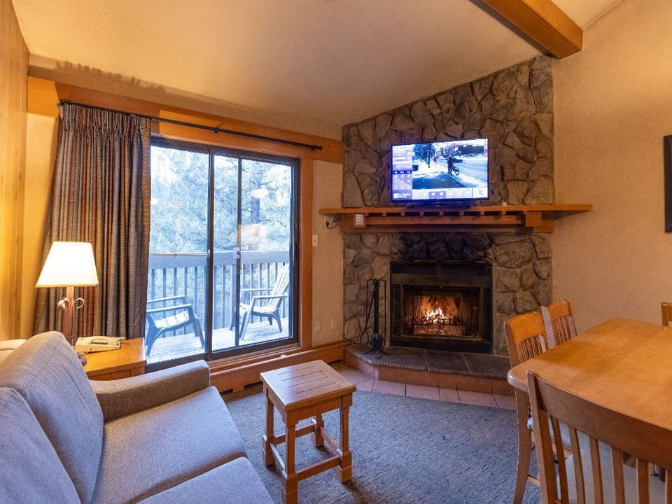 Snuggle up on the comfortable sofa in front of the wood-burning fireplace (wood provided!)