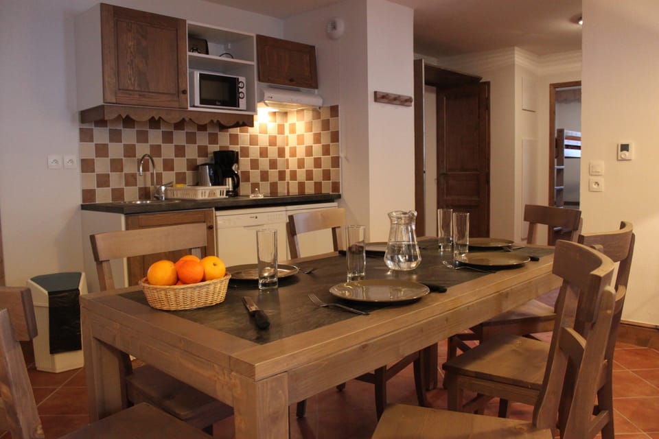 Prepare meals in the kitchenette and enjoy them at the dining table.