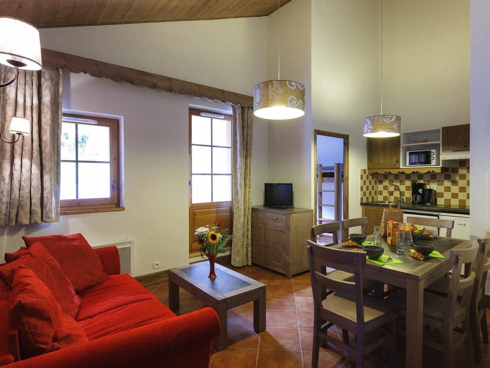 The living area is bright and warm, perfect for relaxing after a wonderful day.