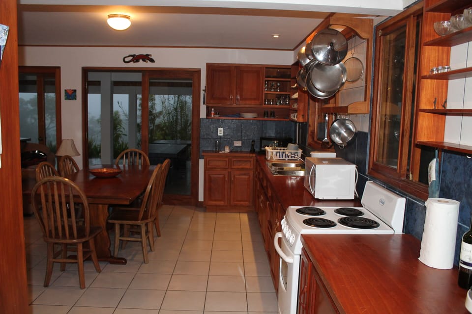 Kitchen view with large dining table.