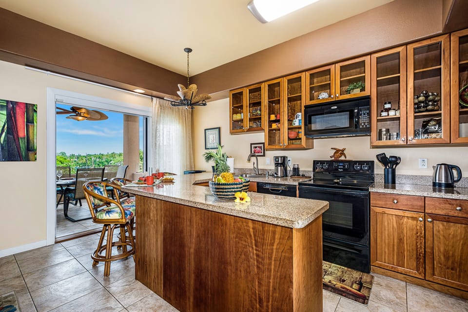 Kitchen with granite counters and view
