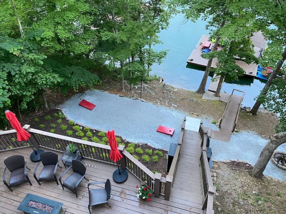 Cornhole set, fire pit + kayaks all await you on the gravel landing halfway down