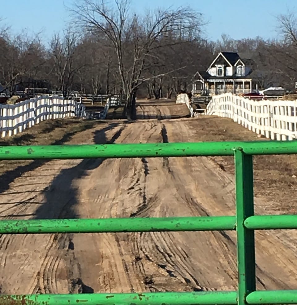 The gate to the property is rustic but functional.  It keeps horses from busy rd
