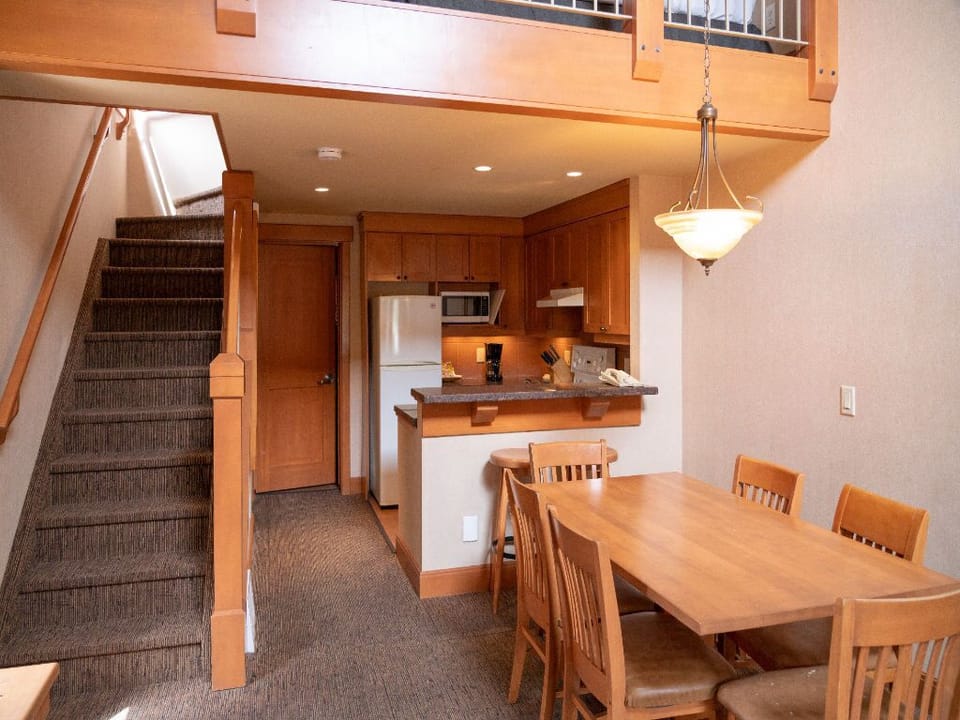 Dine in style in this airy loft-style dining area, blending rustic elegance with modern comfort.