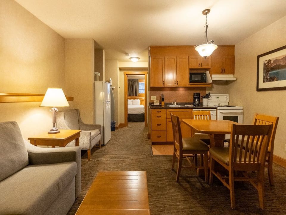 Our cozy mountain condo features warm and inviting living spaces.