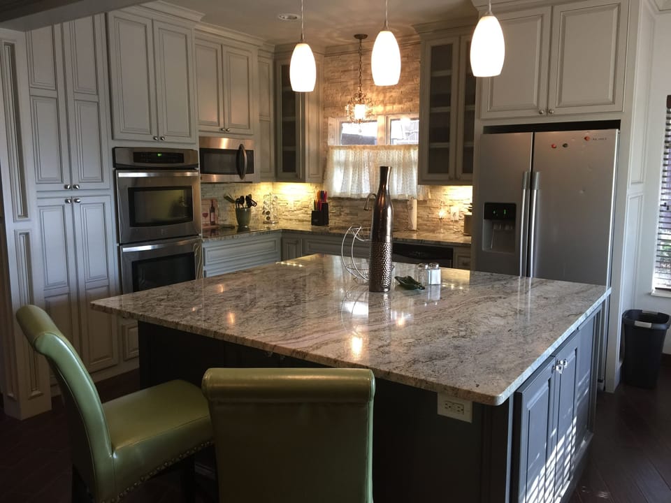 Kitchen equipped with dishes, cookware, double oven, microwave & ceramic cooktop