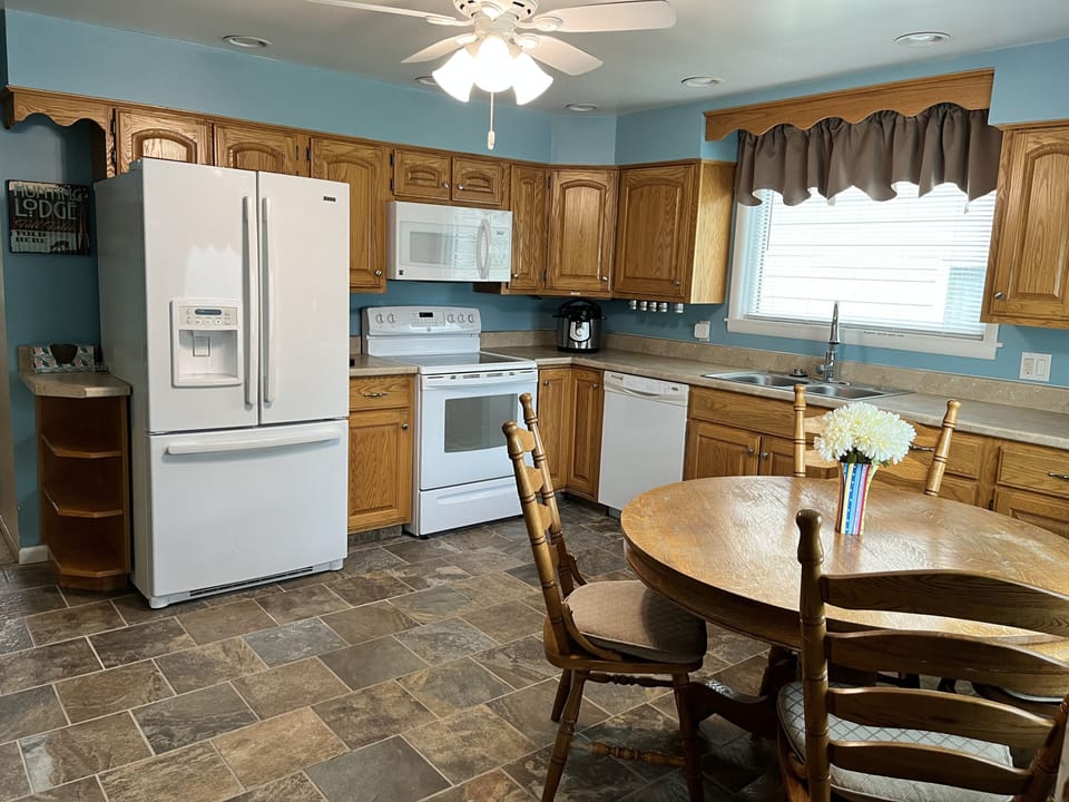 Large modern kitchen with lots of appliances, everything you need except food!