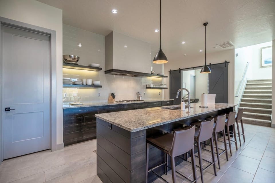 Tremendous kitchen with large island featuring seating for 5