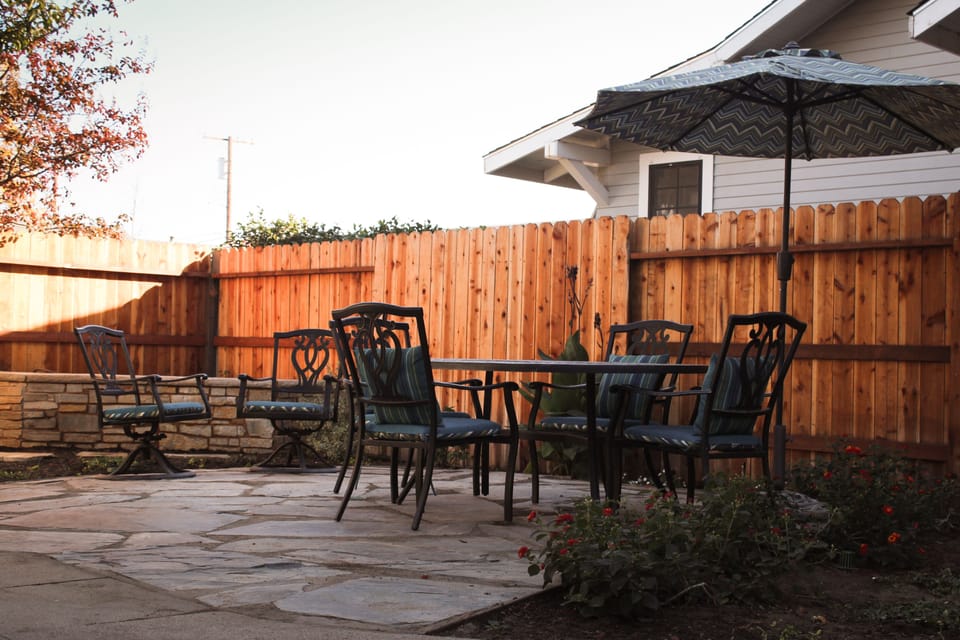Backyard.  Table for six plus extra sitting areas.
