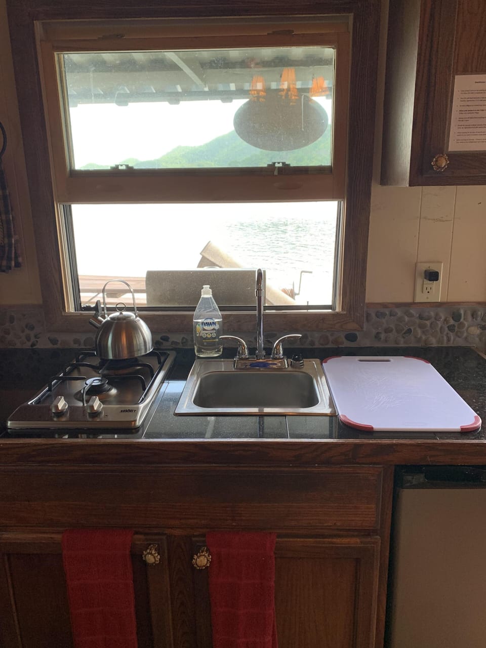 Sink w biodegradable soap, dbl burner cooktop, and under counter fridge/freeze