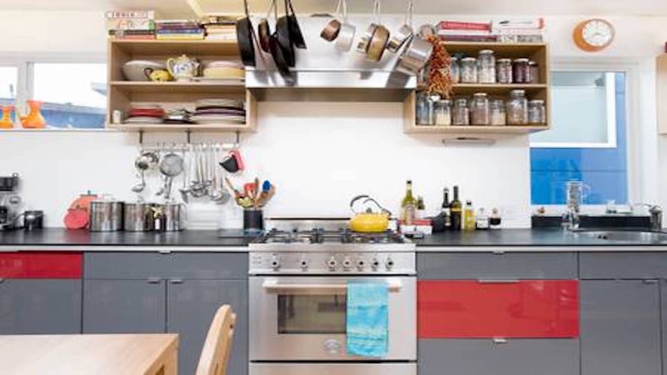 Fully stocked pantry in chef's kitchen, gas range, dishwasher, paperstone countertops.