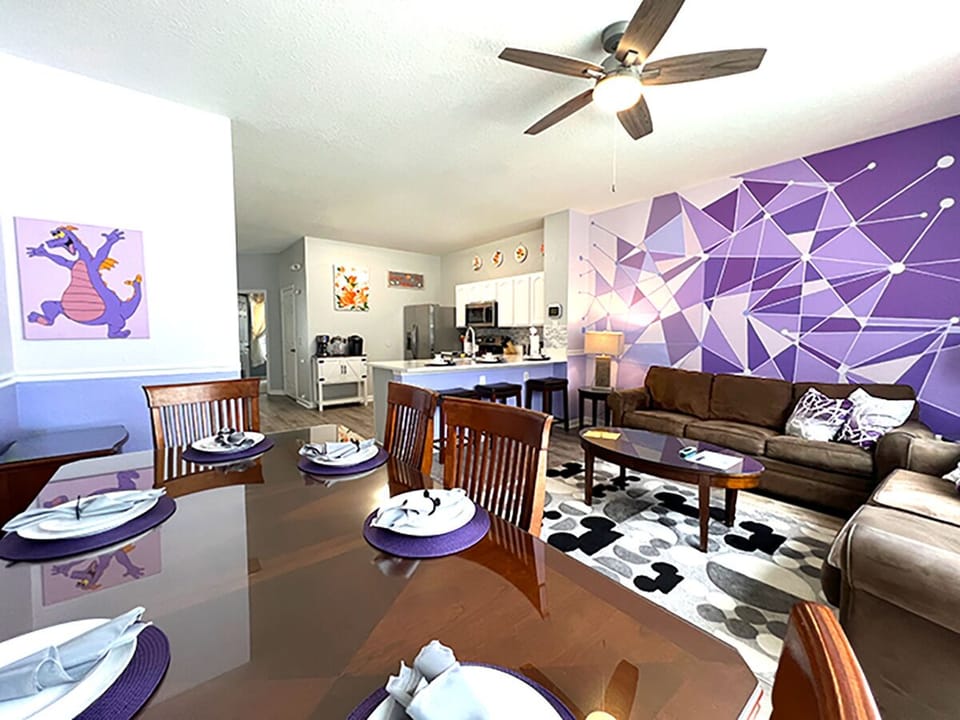 Open layout from kitchen, counter seating, family room, kitchenette & pool view.