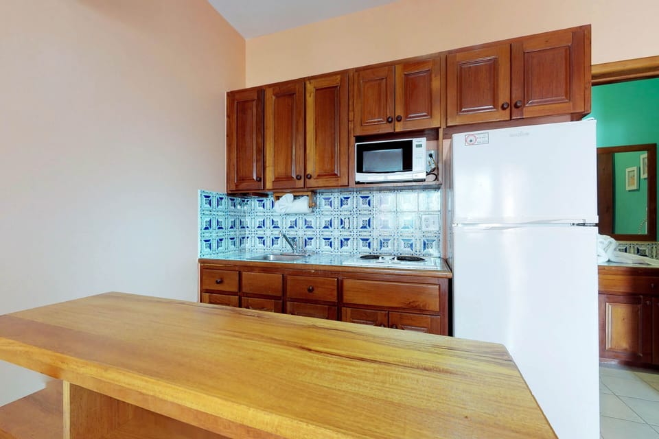 The appliances you need for preparing your meals are available in the kitchen.