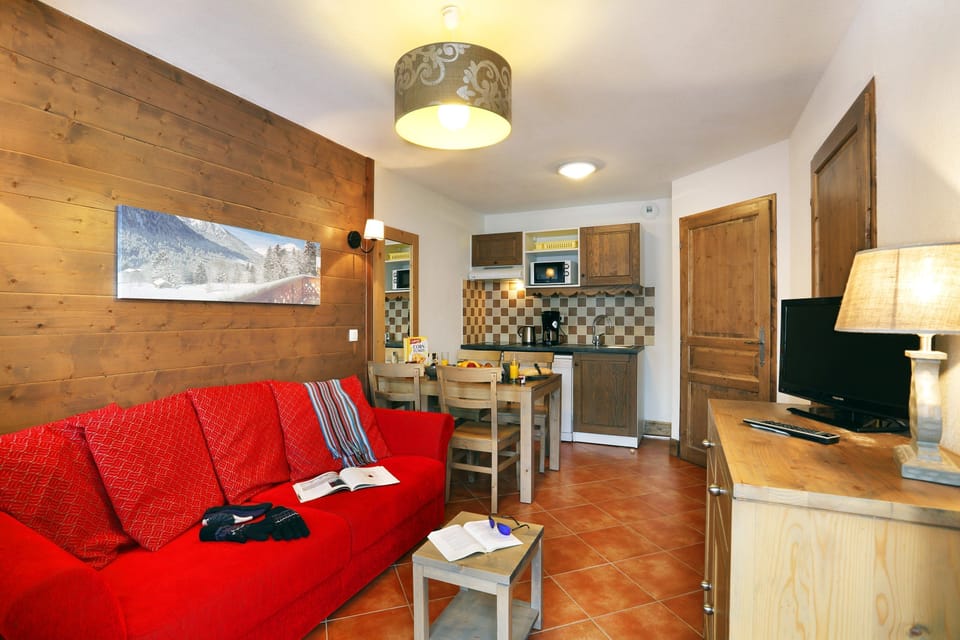 Prepare meals in the kitchenette and enjoy them at the dining table.