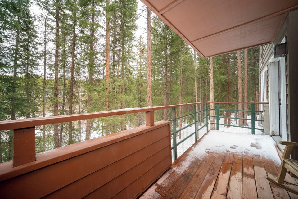 Step onto your private balcony and breathe in crisp forest air while enjoying stunning treetop views that make every morning magical.