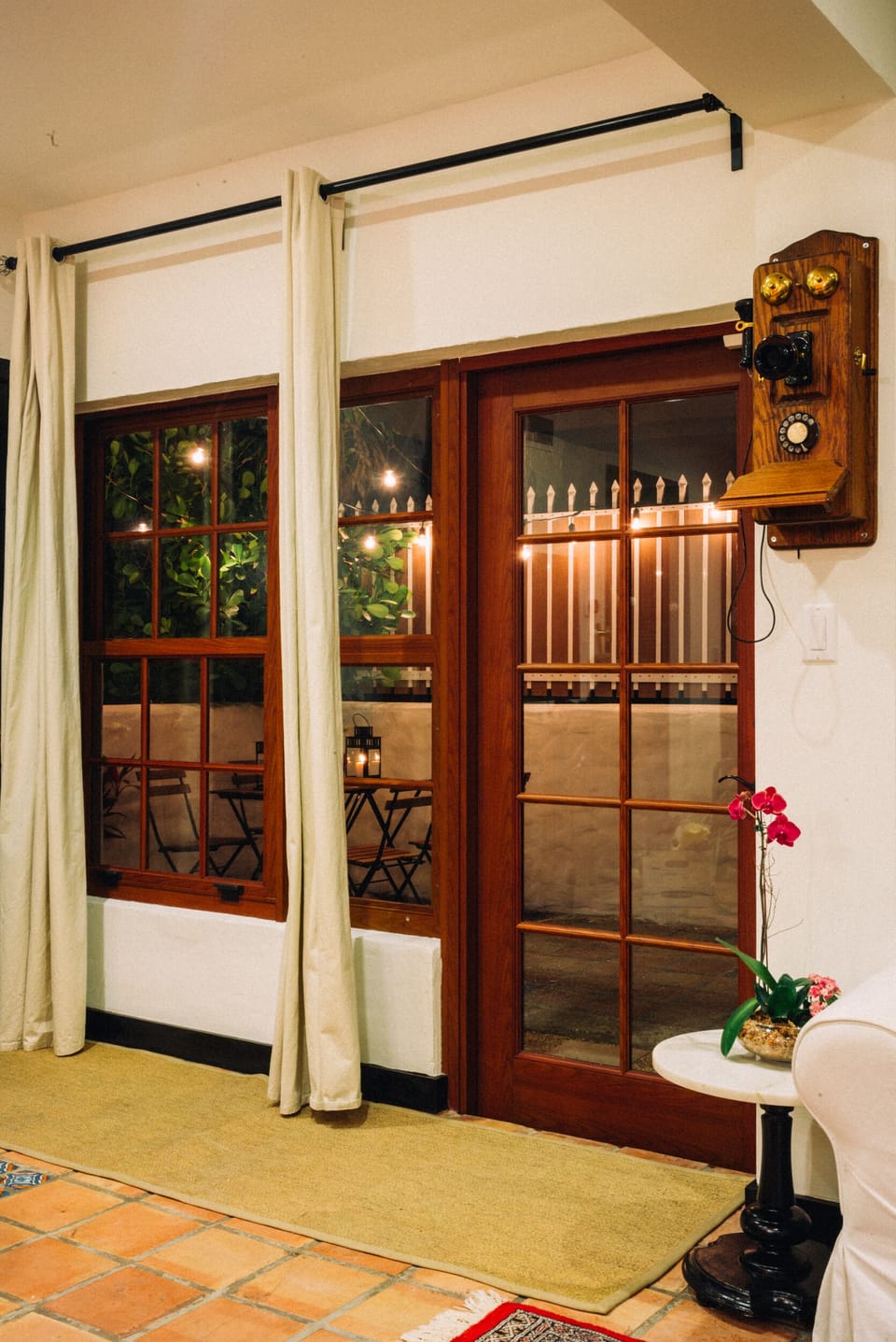 A quaint outdoor area lets you enjoy wine and dinner , or the Florida sunshine.