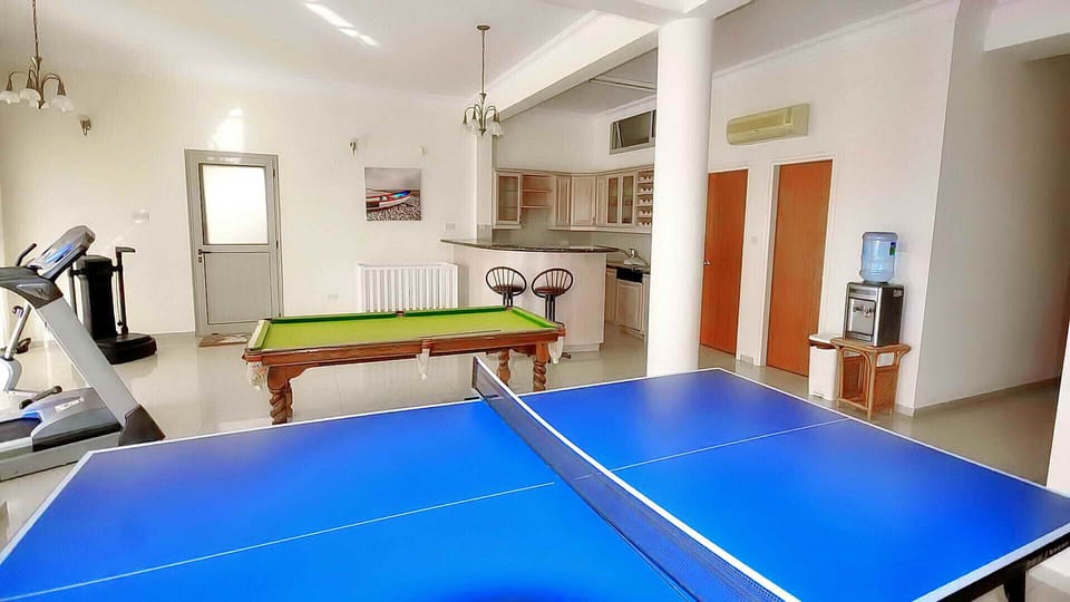 Games room with table tennis and billiards and also gym room.