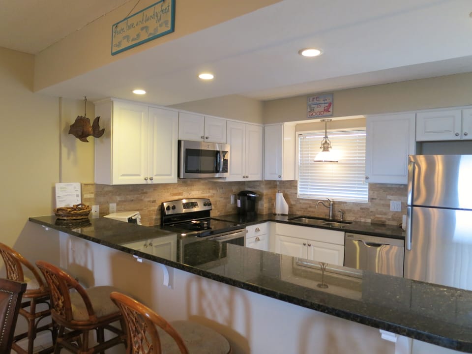 Bar top separating kitchen and dining.