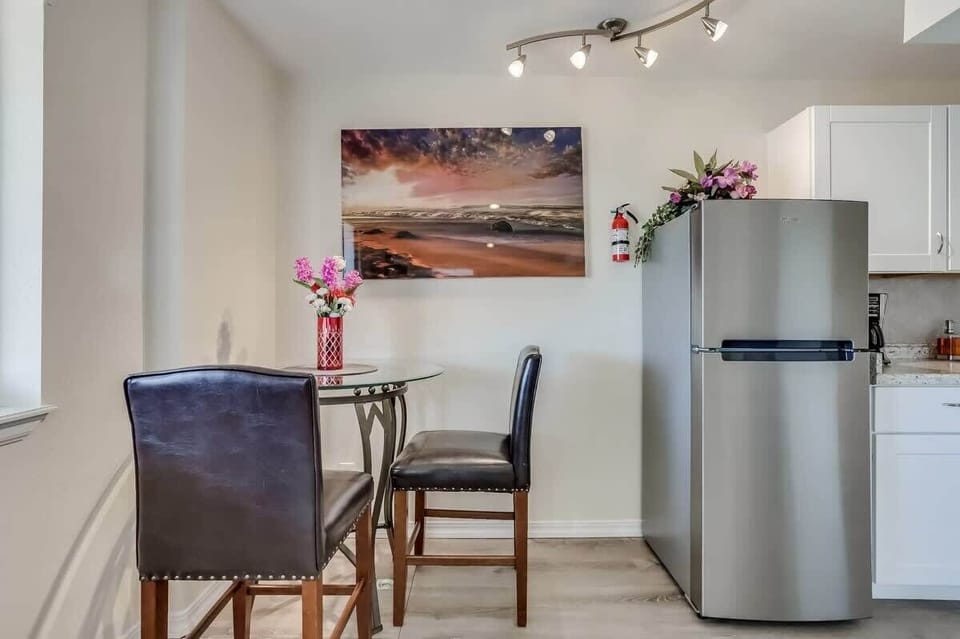 The dining area doubles as a great workspace, providing a practical and functional area for work or study.
