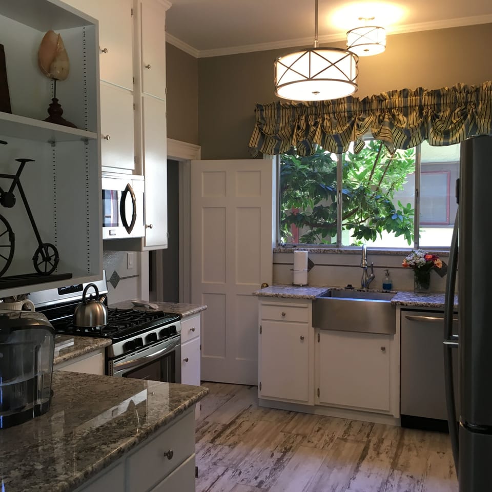 Well-equipped kitchen with gas stove.  