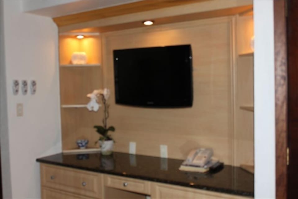large flat screen tv in bedroom