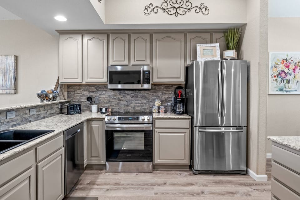 Kitchen with stainless steel appliances.
