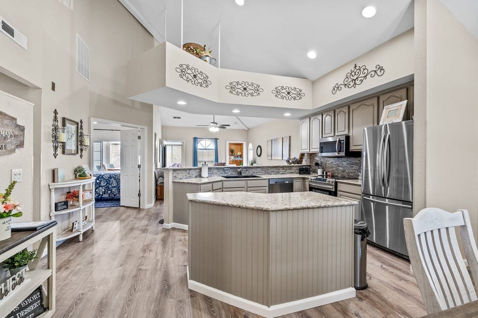Main floor with open concept with dining, kitchen and living room