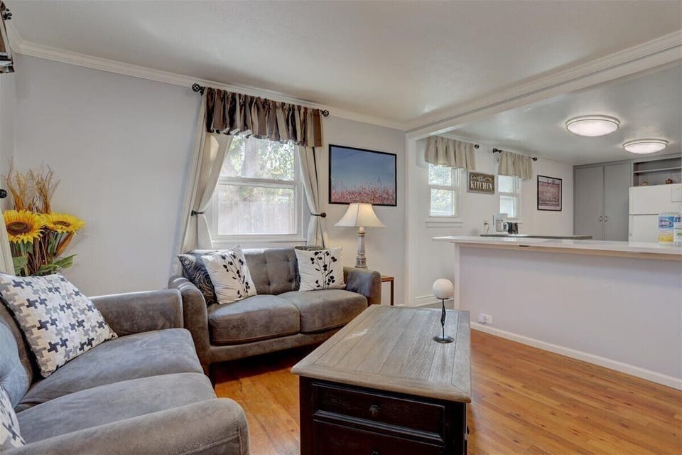 Comfortable sofa eating with coffee table that moves up & down for working.