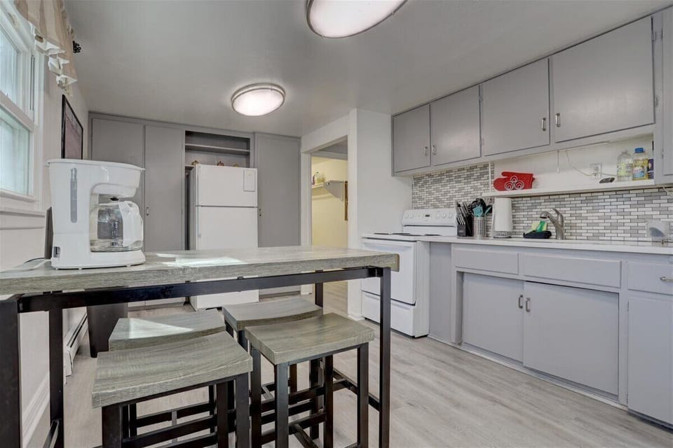 Spacious kitchen open to front living room. Coffee maker, toaster, kettle, etc