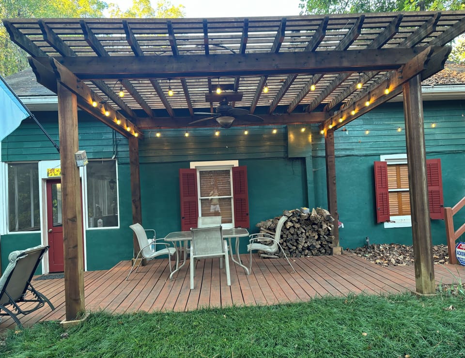 The pergola is for happy hour, the paddle fan overhead keeps the pests away