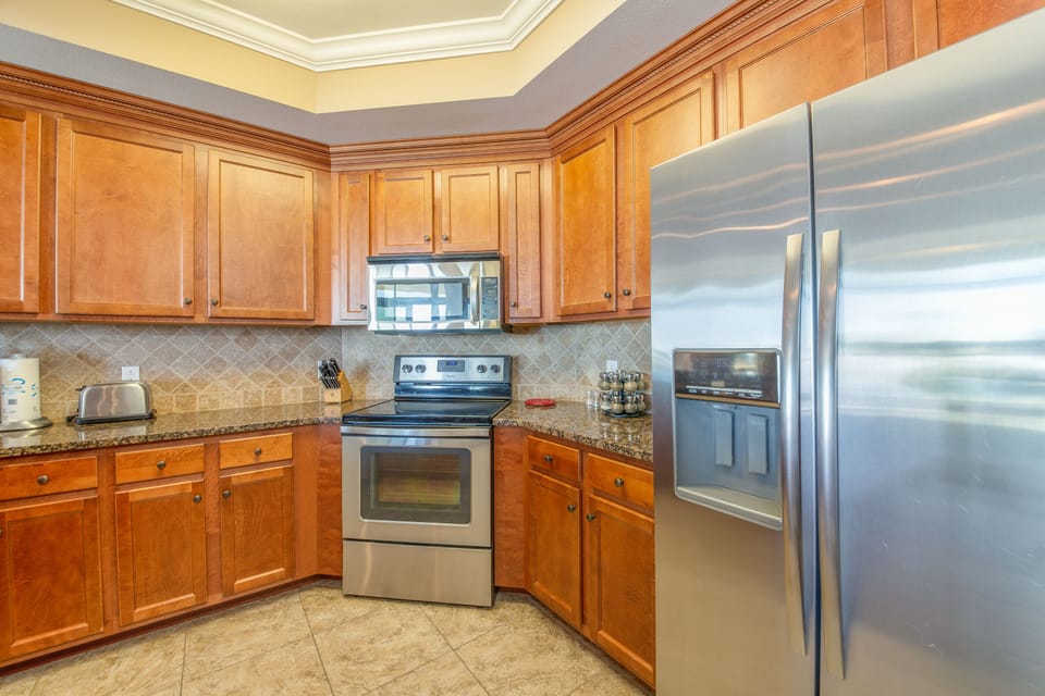 The kitchen has the gadgets and tools for a great vacation.