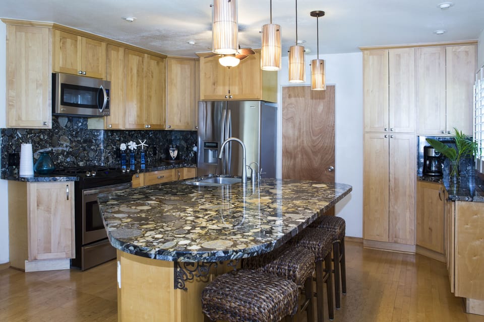 Modern kitchen with everything you need for family meals. Island w/ stools for 6