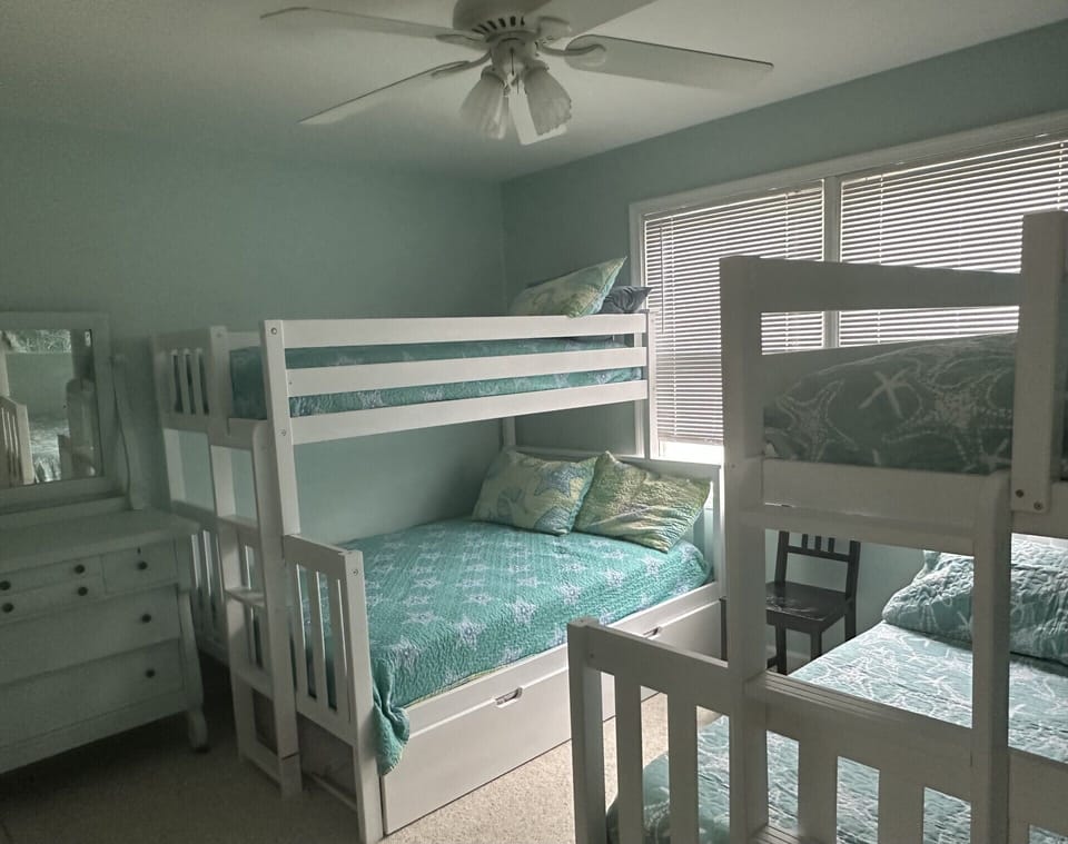 Third bedroom has two bunk beds and one trundle bed (two full, three twin) w/ tv