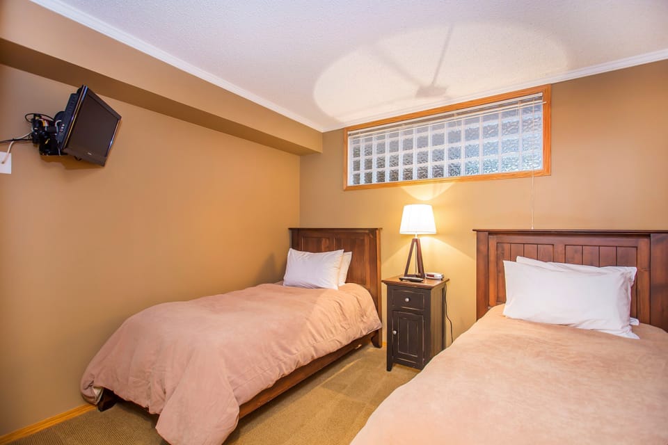 The second bedroom has 2 single beds.