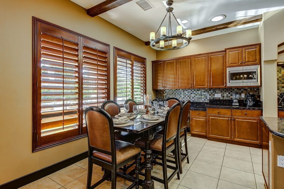 Large formal eat in kitchen area with separate desk for remote workers that brought a laptop.