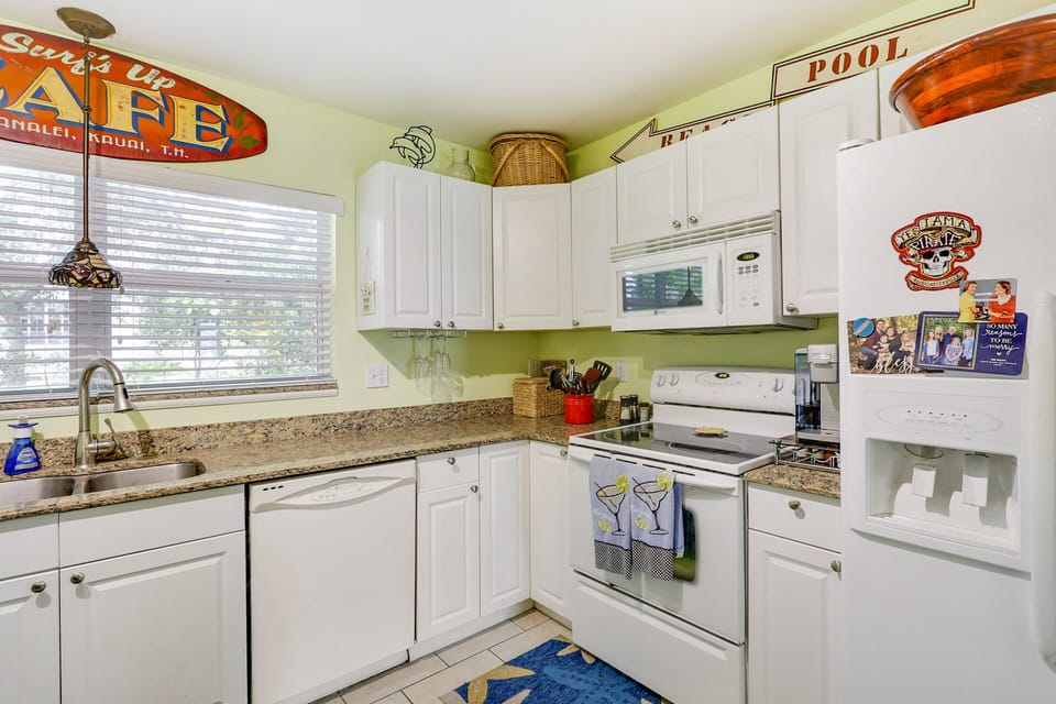 This Kitchen is well stocked with dishes, cooking utensils & appliances 