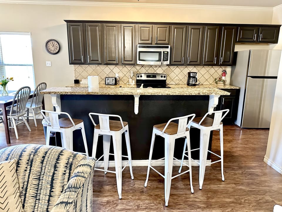 Plenty of seating: 2 tables seat 10 + bar seating for 4!