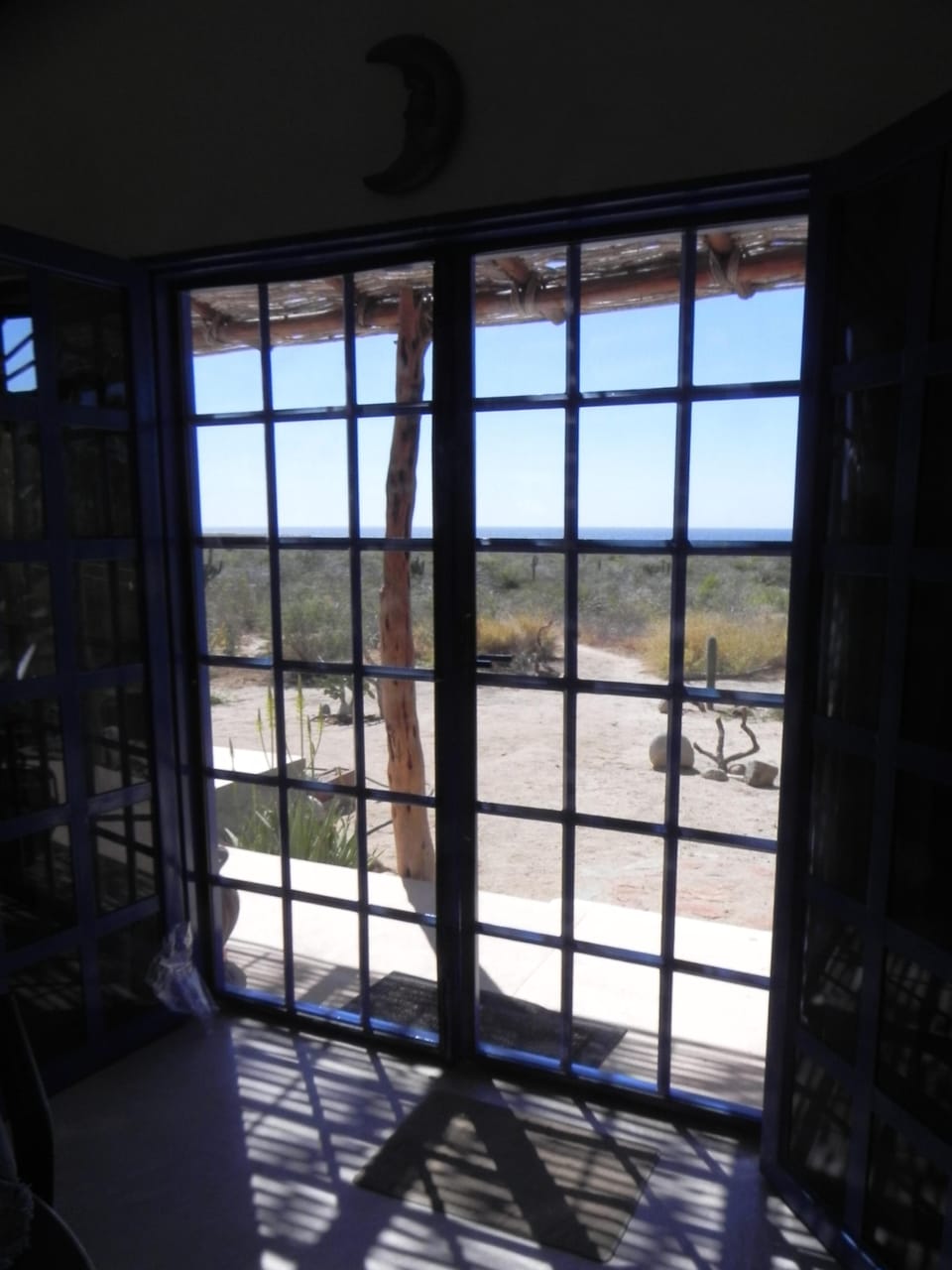 French doors open up to the outside world and beautiful views of Pacific.