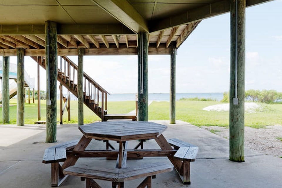 Seated picnic dining for 14 on patio under the house (second table not pictured)