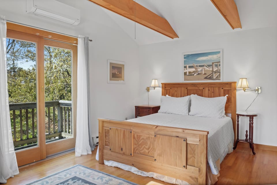 Master bedroom upstairs with TV.