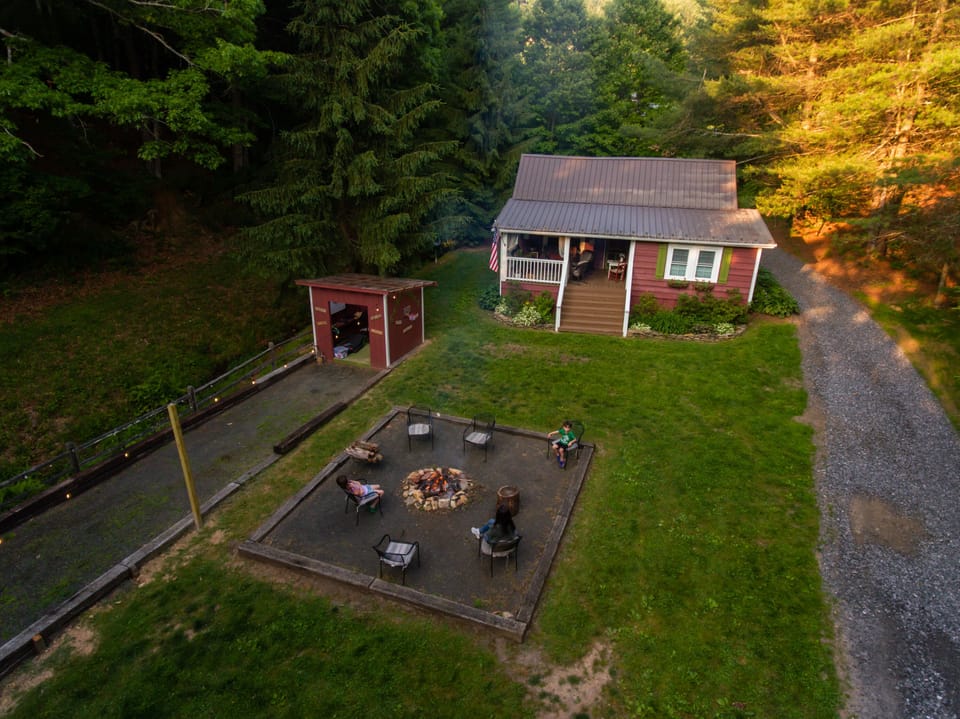 The front yard, fire pit and The Game Shack!