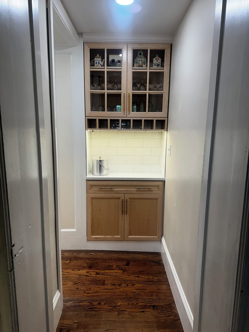 Butler pantry between kitchen and dining room.