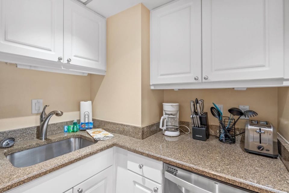 Fully stocked with dishes and basic appliances for ease of preparing home cooked meals.
