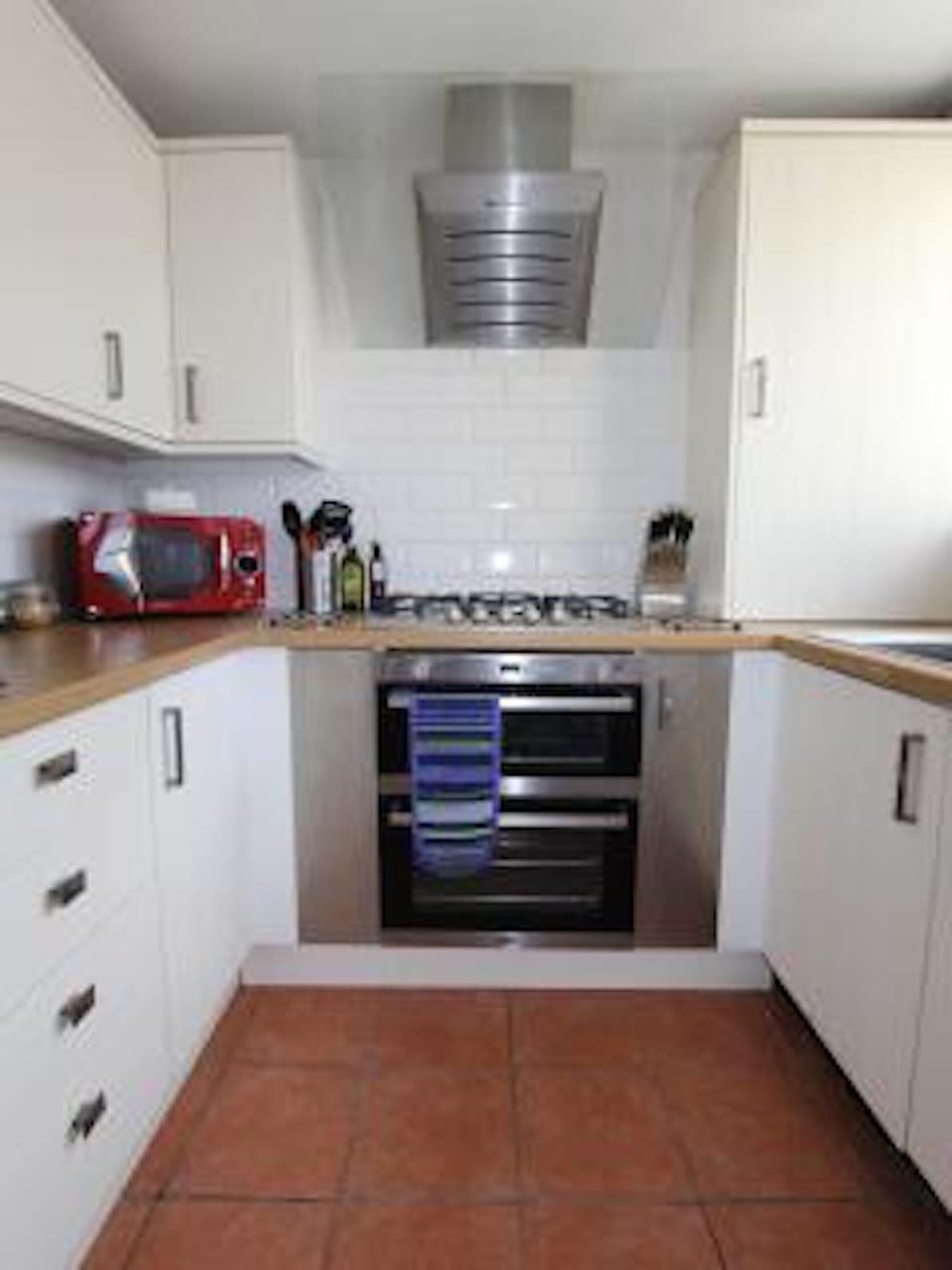 Kitchen with fridge, freezer, dishwasher, microwave