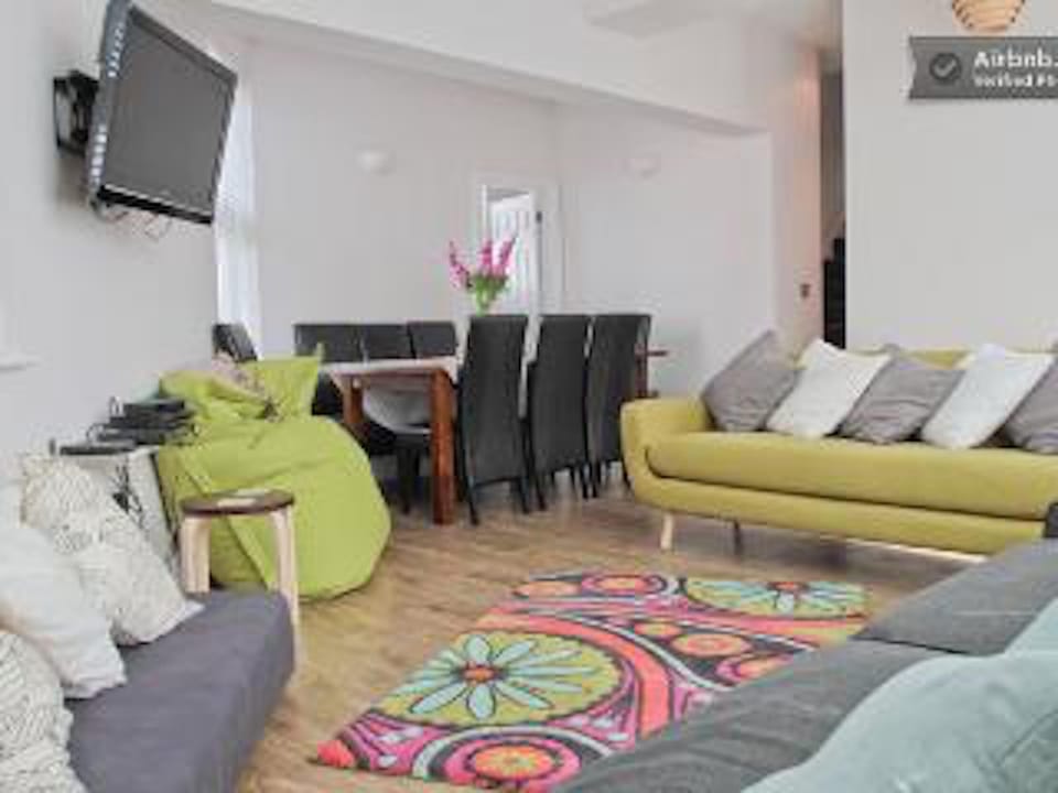 Lounge with TV, Sofas, dvd player, wifi and dining table.