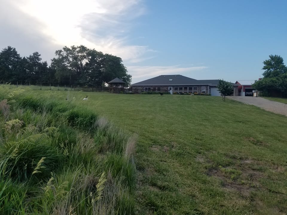 Charming acreage away from traffic, but near all the amenities.  