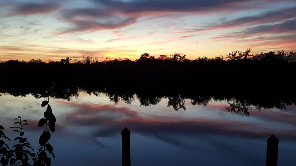 Watch Breathtaking Sunsets Melt Into the Water Every Evening