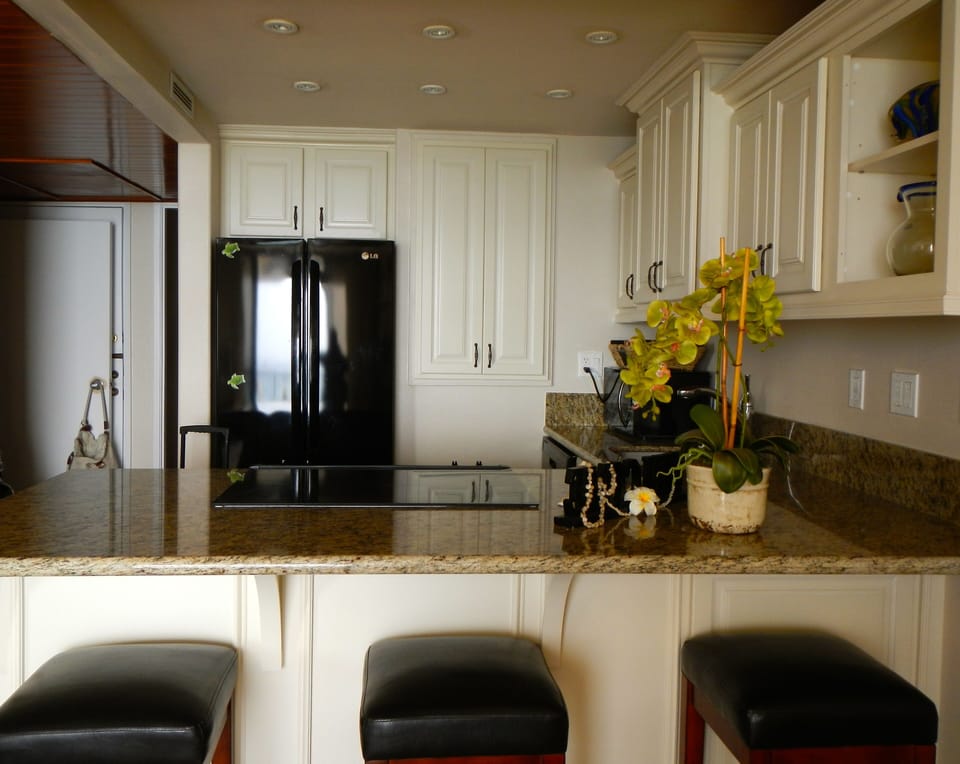 Remodeled kitchen with new cabinets, granite, appliances, and flooring.
