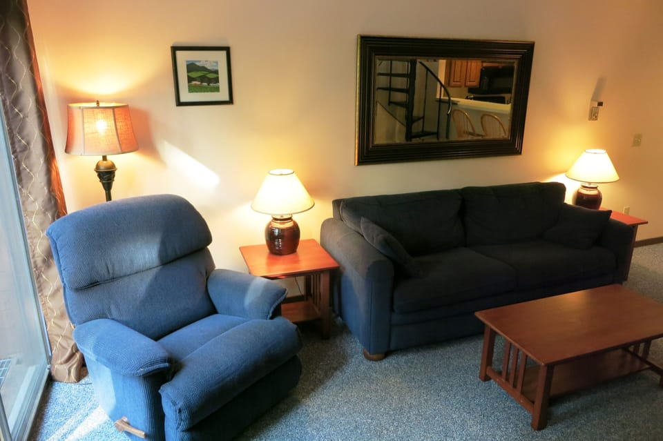 Comfy sofa and recliner! Sofa opens to a queen-size mattress.